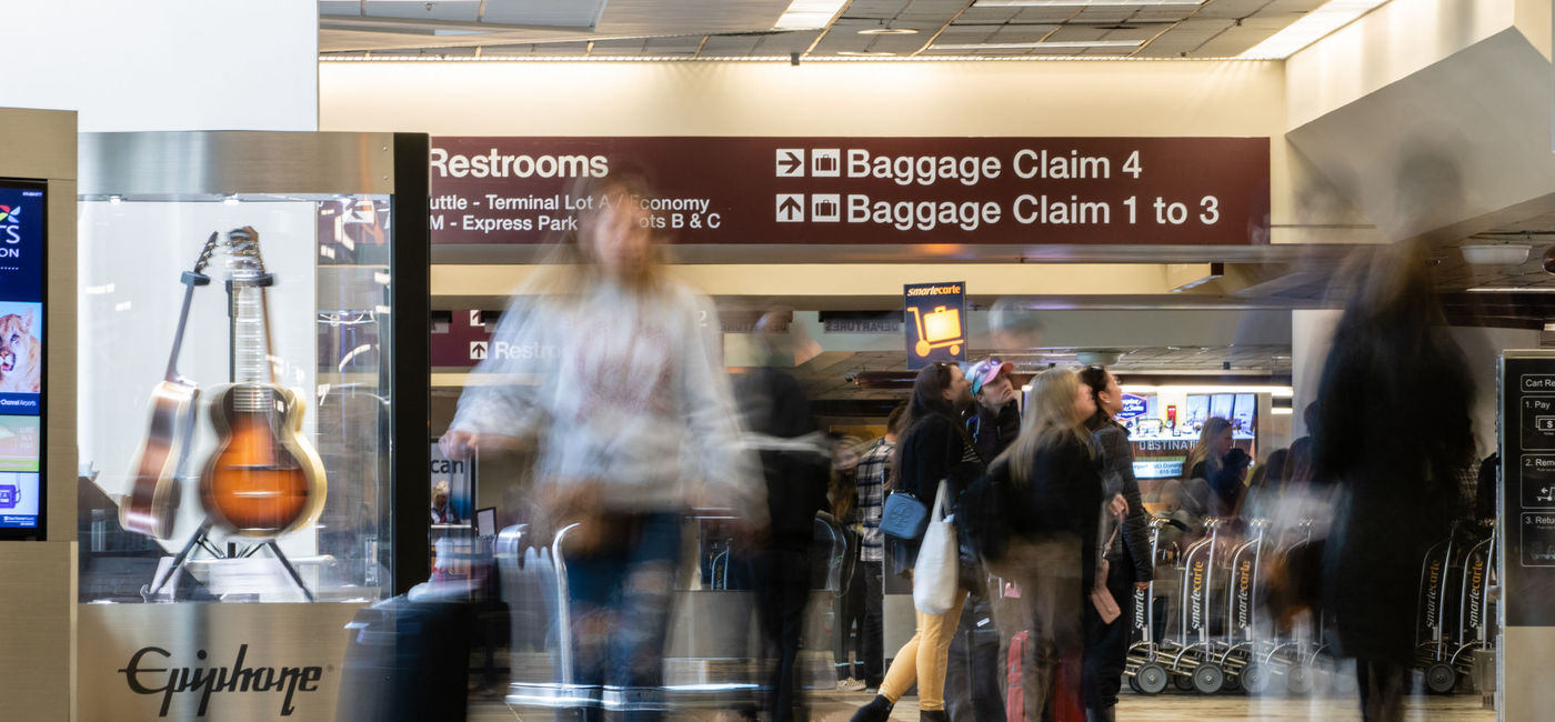Image: Travelers in the baggage claim area at Nashville International Airport. (Photo Credit: Scott Heaney/iStock Editorial/Getty Images Plus)