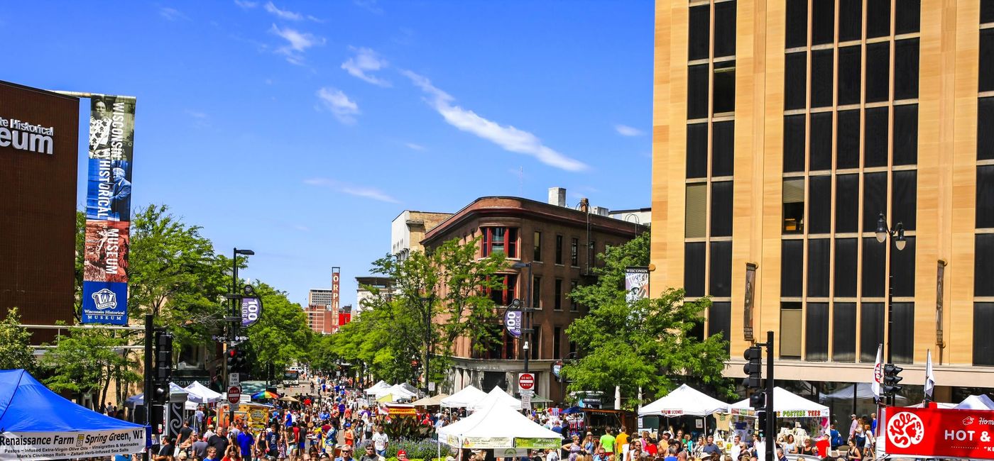Image: The survey found that travelers would select activities that avoid crowds. Pictured, a farmer's market in Madison, Wis. (photo via csfotoimages/iStock Editorial/Getty Images Plus)