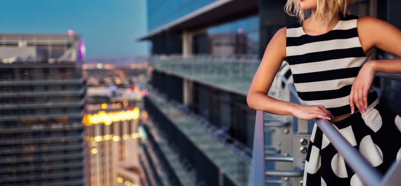 Image: A woman stands on her balcony at The Cosmopolitan of Las Vegas. (photo via The Cosmopolitan of Las Vegas) ((photo via The Cosmopolitan of Las Vegas))