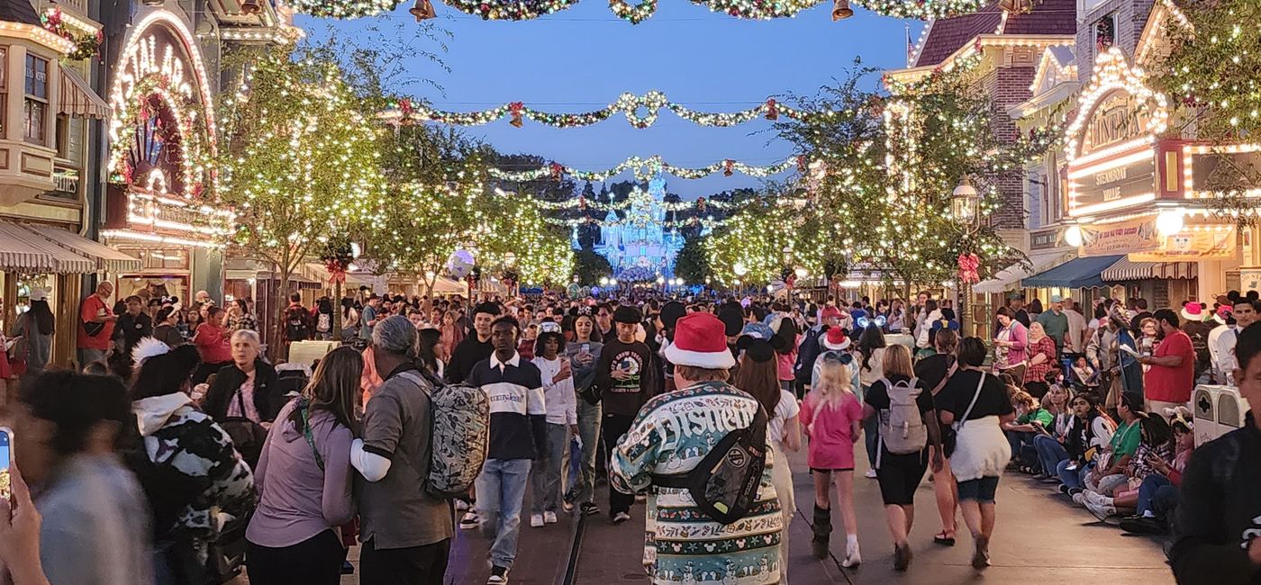 Image: At dusk, the holiday lights illuminate Main Street USA and Sleeping Beauty's Winter Castle at Disneyland.  (Photo Credit: Northstar Travel Group / Laurie Baratti)
