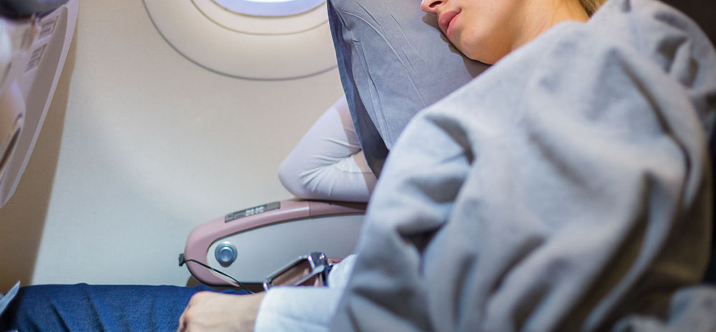 Image: PHOTO: Sleeping on an airplane. (photo courtesy of Thinkstock)