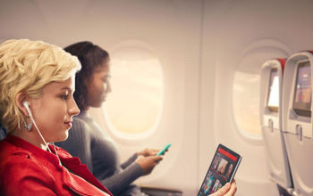 wi-fi, wifi, wifi on plane, Delta traveler, entertainment on flight, travel, passenger, listening to music, plane, aircraft, seat, tablet, phone