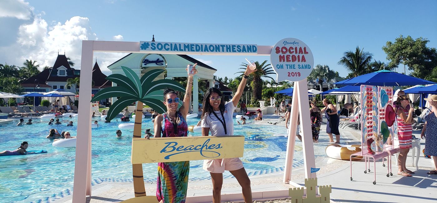 Image: PHOTO: Photographer Laura Dee and Debbie-Ann White, senior vice president of public relations and promotions for Unique Vacations, Inc., strike a pose during the fifth annual “Social Media on the Sand” event at Beaches Turks & Caicos Resort Villages and Spa. (Photo by Joe Pike)