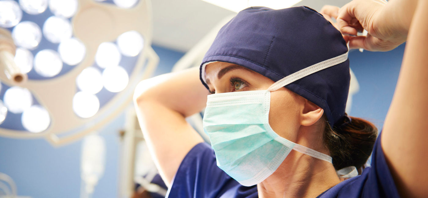 Image: PHOTO: Doctor wearing a surgical mask. (photo via iStock / Getty Images Plus / gpointstudio)