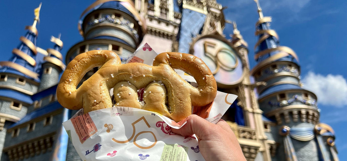 Image: Mickey pretzel wrapped in celebratory paper at Magic Kingdom (Photo via Brooke Geiger McDonald)