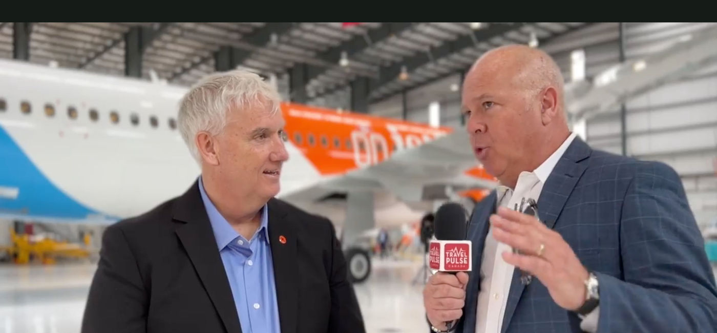 Image: TravelPulse Canada's John Kirk interviews Jetlines CCO Duncan Bureau at the unveiling of the carrier's first A-320. (TravelPulse Canada)