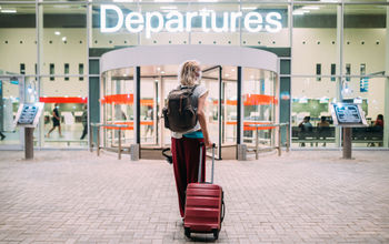 Woman, airport, flight, departures, gate, terminal, mask, suitcase, luggage, baggage, COVID-19, pandemic