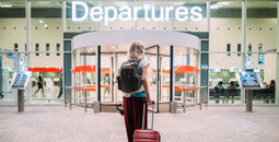 Woman, airport, flight, departures, gate, terminal, mask, suitcase, luggage, baggage, COVID-19, pandemic