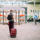 Woman, airport, flight, departures, gate, terminal, mask, suitcase, luggage, baggage, COVID-19, pandemic