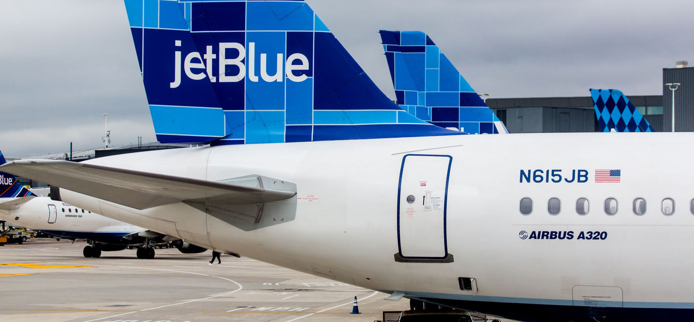 Image: Airbus A320 JetBlue tailfin with Mosaic design. (photo via rypson / iStock Editorial / Getty Images Plus)