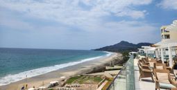 The coastline of the resort, featuring the Pacific Ocean and the Sierra Madre Occidental mountain range