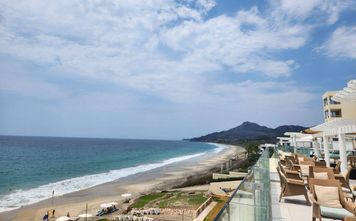 The coastline of the resort, featuring the Pacific Ocean and the Sierra Madre Occidental mountain range