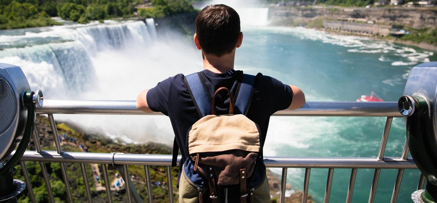 Image: Tourists enjoying the views at Niagara Falls (Photo via M_a_y_a/E+)