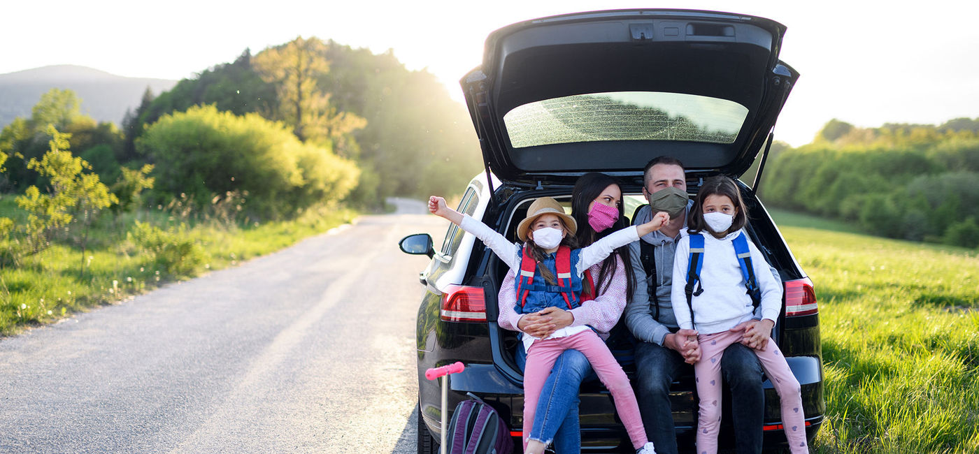 Image: HOTO: Family on a road trip in masks (Photo courtesy Halfpoint/iStock/Getty Images Plus)