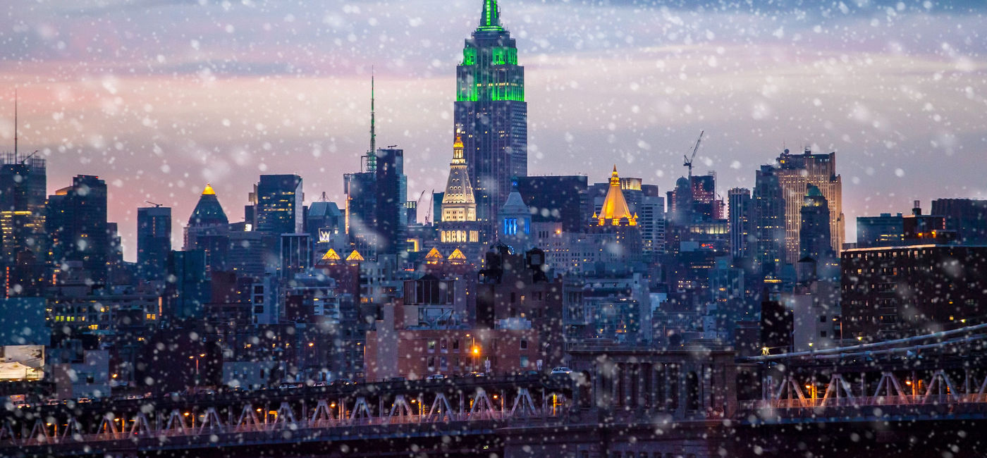 Image: Snow falling in New York City. (Photo via iStock / Getty Images Plus / GummyBone)