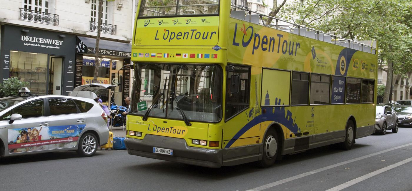Image: PHOTO: Tourist Bus in Paris, France. (photo via Mauvries/iStock Editorial/Getty Images Plus)