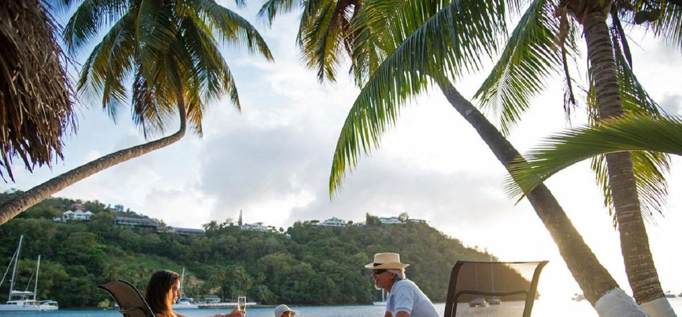 Image: PHOTO: Guests of Marigot Bay Resorts & Marina enjoying beach time. (photo courtesy of Marigot Bay Resort & Marina)
