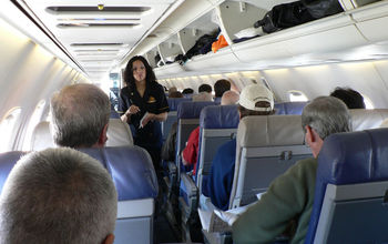 flight attendant talking passengers