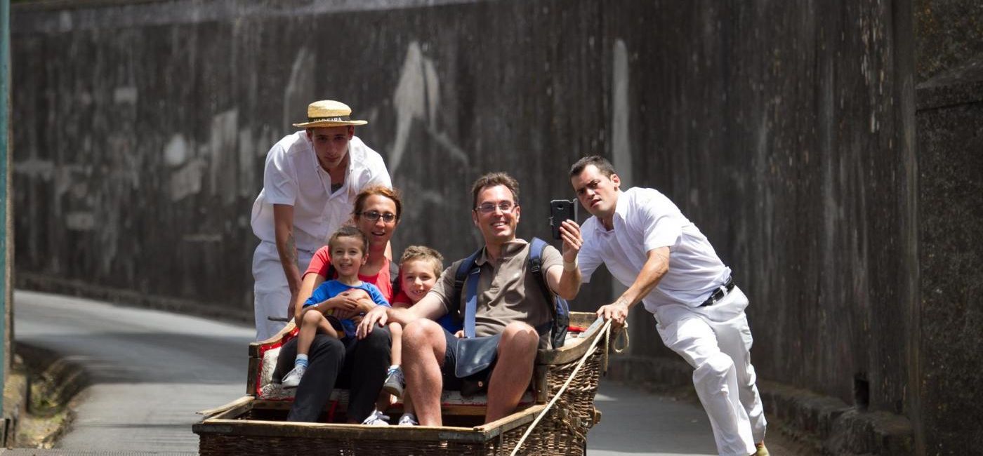 Image: A family enjoys a ride by the Carreiros do Monte in Monte, Funchal, Madeira. (photo via Madeira) ((photo via Madeira))