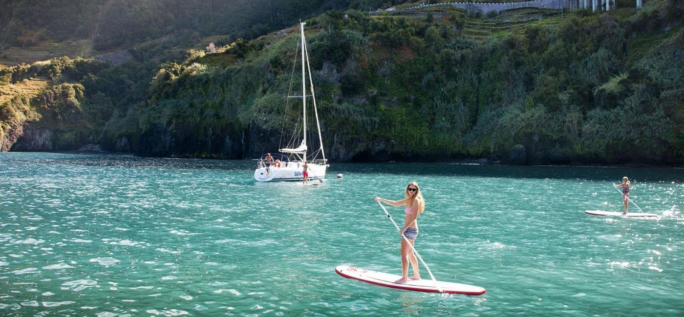 Image: Two women enjoy stand-up paddleboarding along the Madeira coast. (photo via Madeira) ((photo via Madeira))