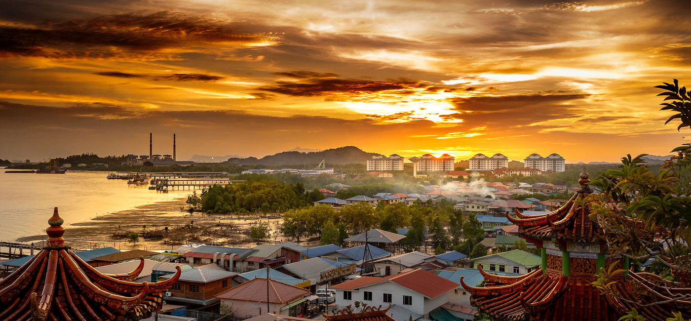 Image: Sunset over Kuching, Sarawak, Malaysia. (photo via iStock/Getty Images Plus/chaolik)