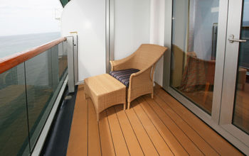 Single chair on solo stateroom balcony.