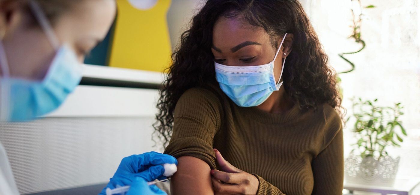 Image: Woman getting vaccinated. (photo via getty images / vgajic)