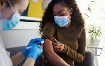 Woman getting vaccinated