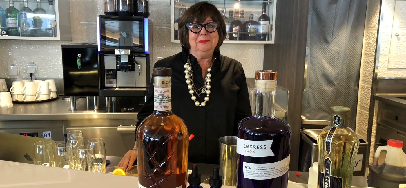 Image: Regina Charboneau, culinary ambassador for American Queen Voyages, leads a cocktail-making demonstration. (Photo via Theresa Norton)