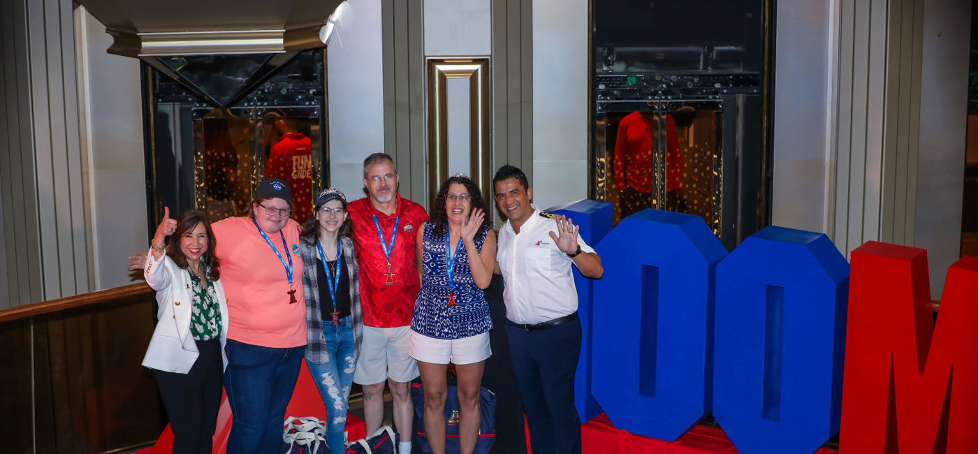 Image: Carnival President Christine Duffy, the Clifford Family and Carnival Sunrise Captain Luca Cherchi. (photo courtesy of Carnival Cruise Line)