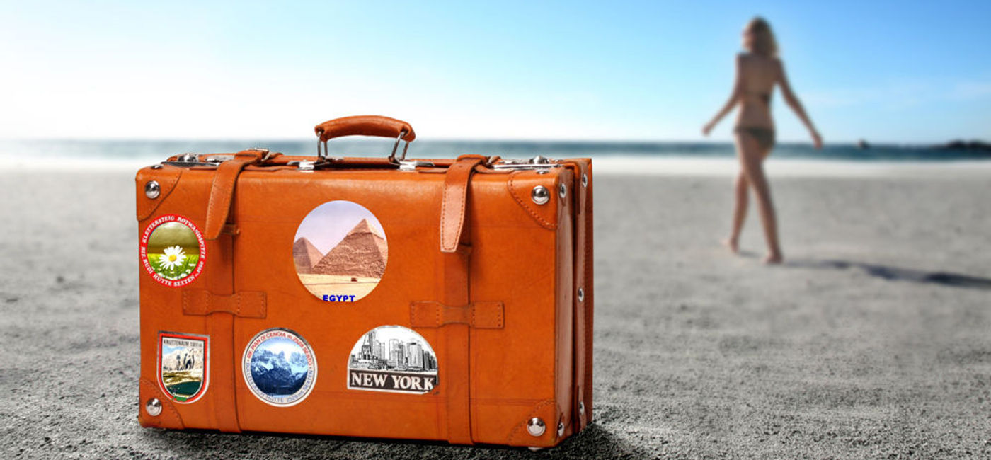 Image: PHOTO: Suitcase on the beach. (photo courtesy of Thinkstock)