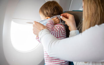 A toddler on a plane