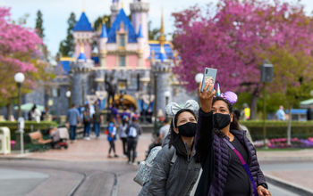 Guests taking a selfie at Disneyland in Anaheim, California.