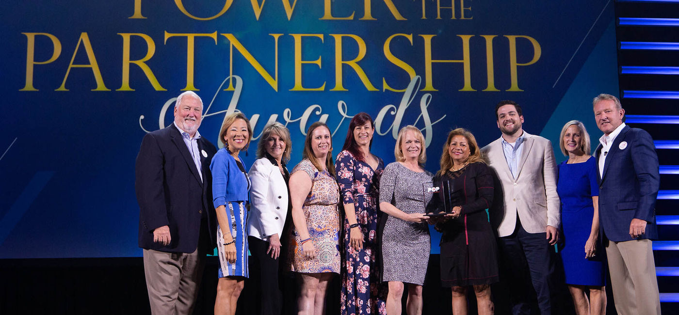 Image: PHOTO: The team from Globus Family of Brands flanked on their right by Roger E. Block, president, Travel Leaders Network and their left by John Lovell, president, leisure travel, supplier relations and networks for Travel Leaders Group. (photo courtesy Travel Leaders)
