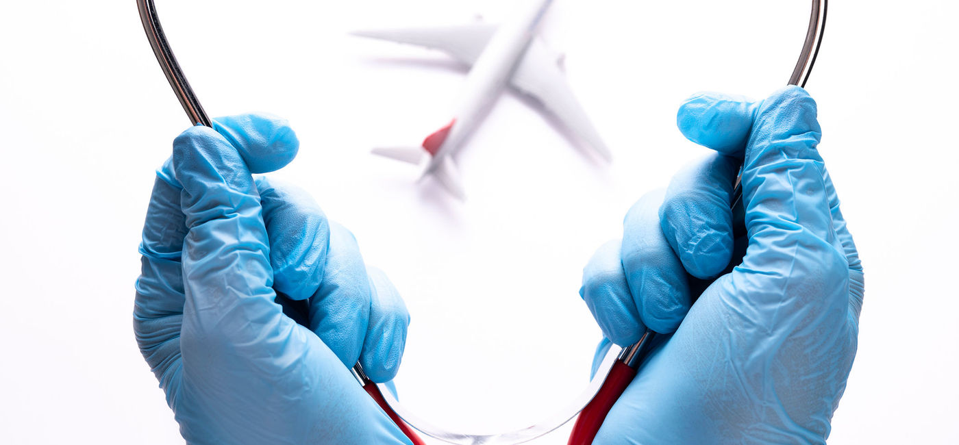 Image: Doctor's hand with blue gloves hanging a stethoscope. (photo via isayildiz / iStock / Getty Images Plus)