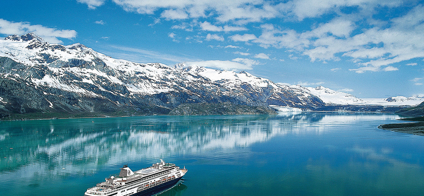 Image: A House committee is seeking a way to allow cruising in Canadian waters this year. Pictured is a Holland America Line ship in Alaska. (Photo courtesy of Holland America Line)