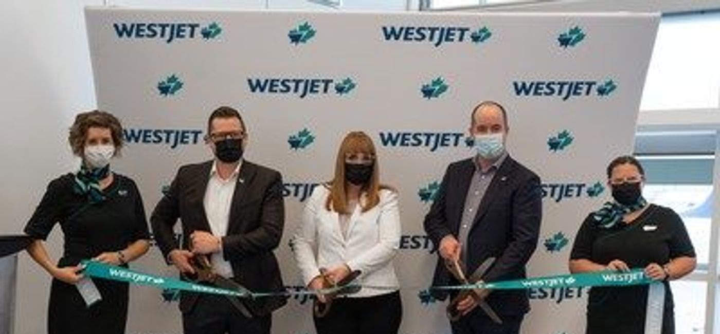 Image: The official ribbon-cutting for WestJet's new service from Calgary International to London Healthrow. (WestJet)