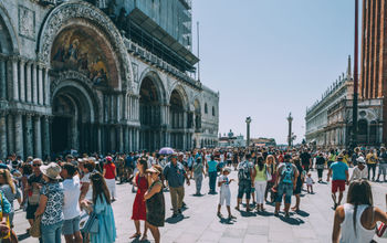 Crowds of travelers in St. Mark's Square, Venice, Italy