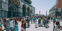 Crowds of travelers in St. Mark's Square, Venice, Italy