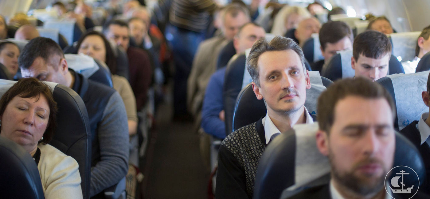 Image: Des passagers en avion. (Photo: Flickr/Saint-Petersburg Theological Academy)