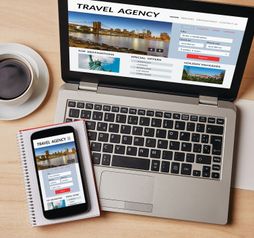 Travel agency concept on laptop and smartphone screen
