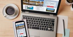 Travel agency concept on laptop and smartphone screen