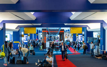 People walking inside Terminal C at LaGuardia Airport in New York City
