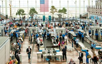 People traveling through security to the gates of Denver International Airport