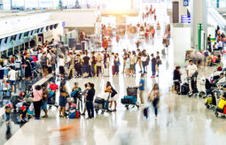 Crowd of travelers waiting for check-in