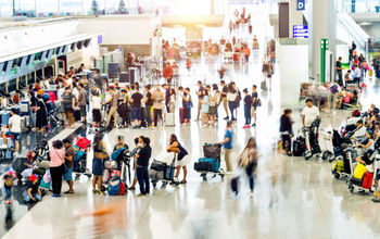 Crowd of travelers waiting for check-in