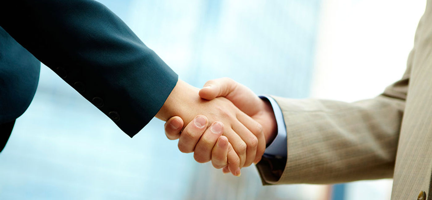 Image: PHOTO: Businessmen shaking hands. (photo courtesy of Thinkstock)