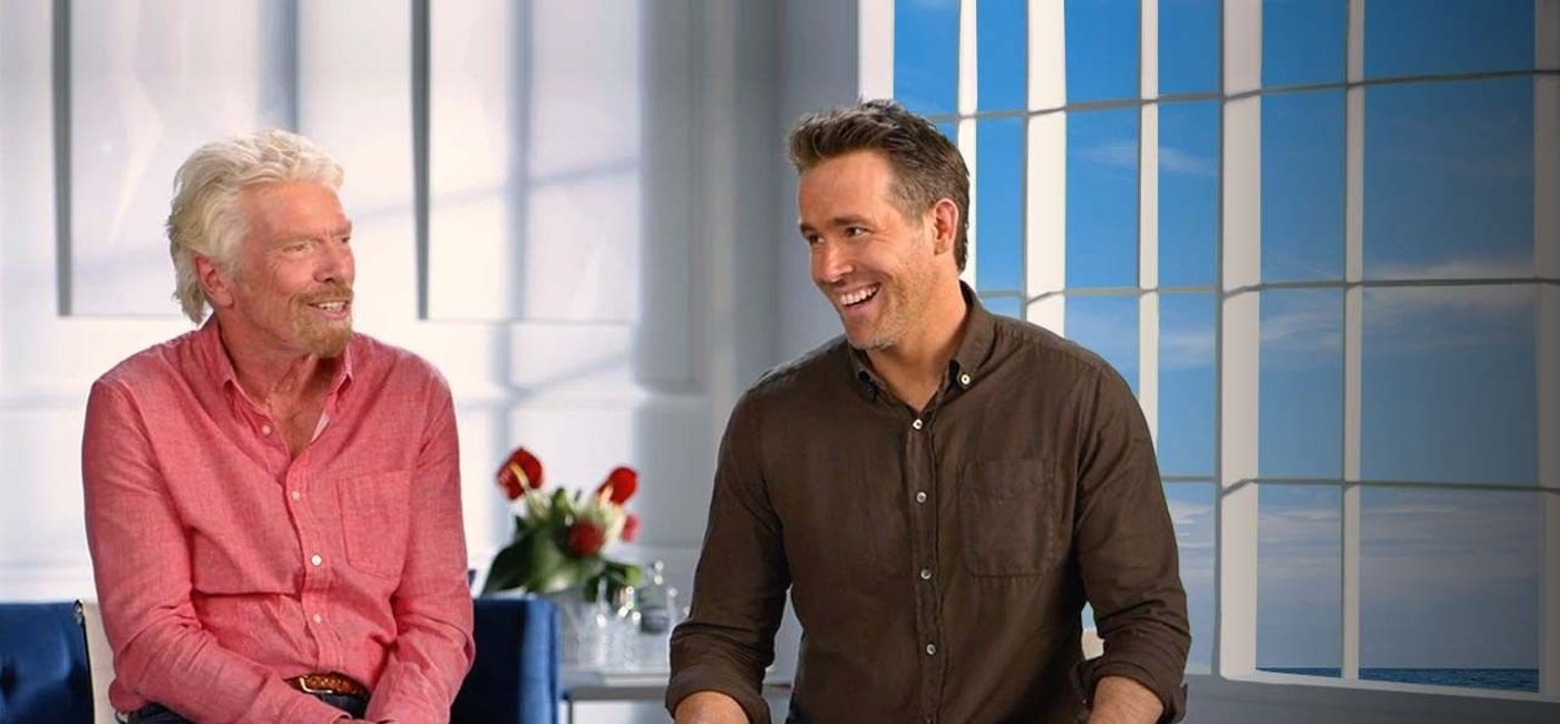 Image: Richard Branson and Ryan Reynolds for Virgin Voyages and Aviation American Gin. (photo via Virgin Voyages Media)