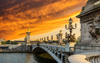 Paris bridge at sunset.