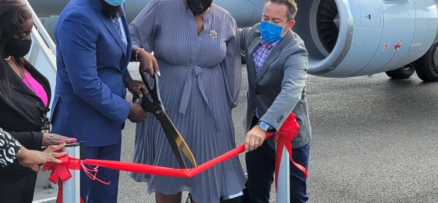 Image: Hadyn Hughes, Anguilla's tourism minister, welcomes inaugural American Airlines flight with Quincia Gumbs-Marie, Anguilla parliamentary secretary and Jorge Ramirez, American's vice president - envoy international operations. (Photo by Brian Major)